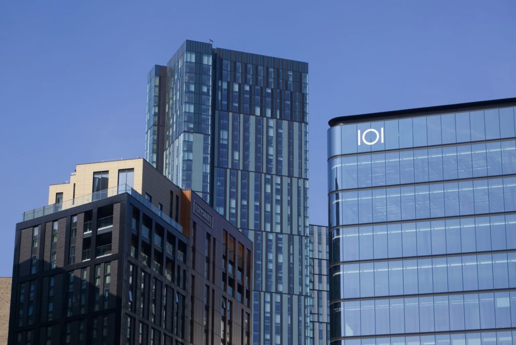 Skyscrapers and modern buildings against blue sky.